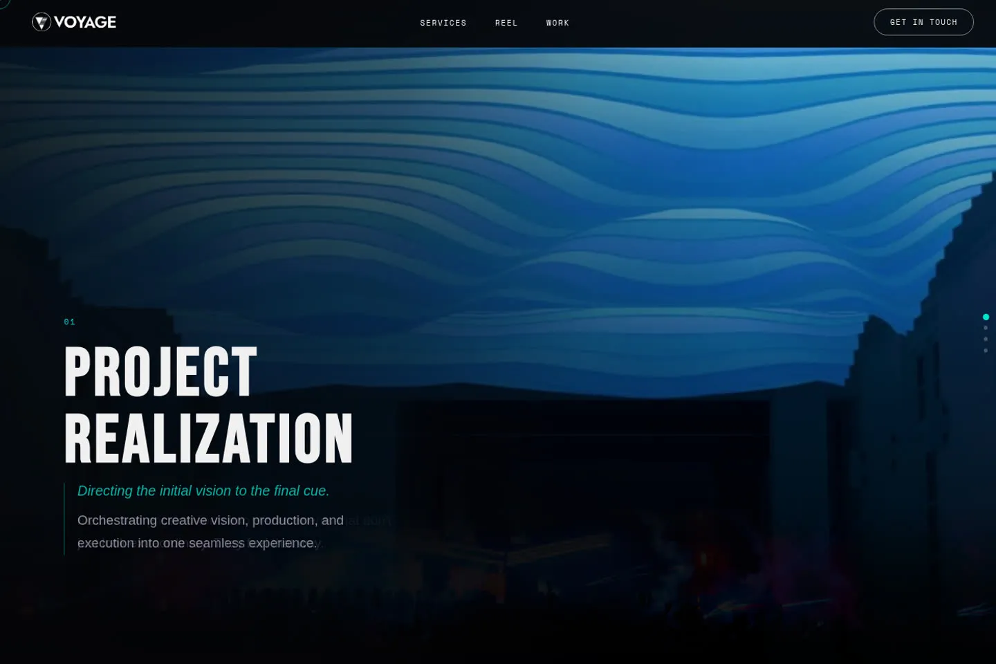 Voyage Productions live homepage: a dark cinematic section with the heading Project Realization in condensed display type over a blue stage-lighting still.